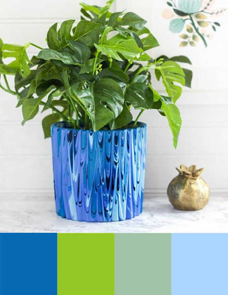 A green and blue color palette with a paint poured planter